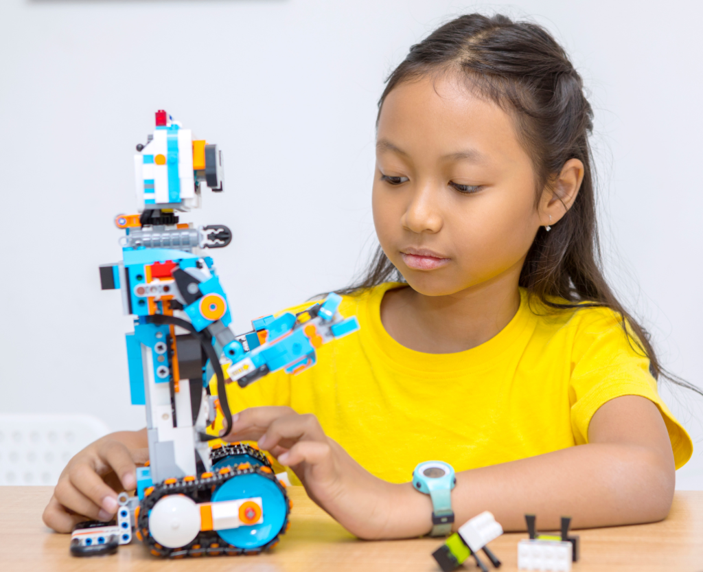 Mentor guiding students through a robotics or design challenge.